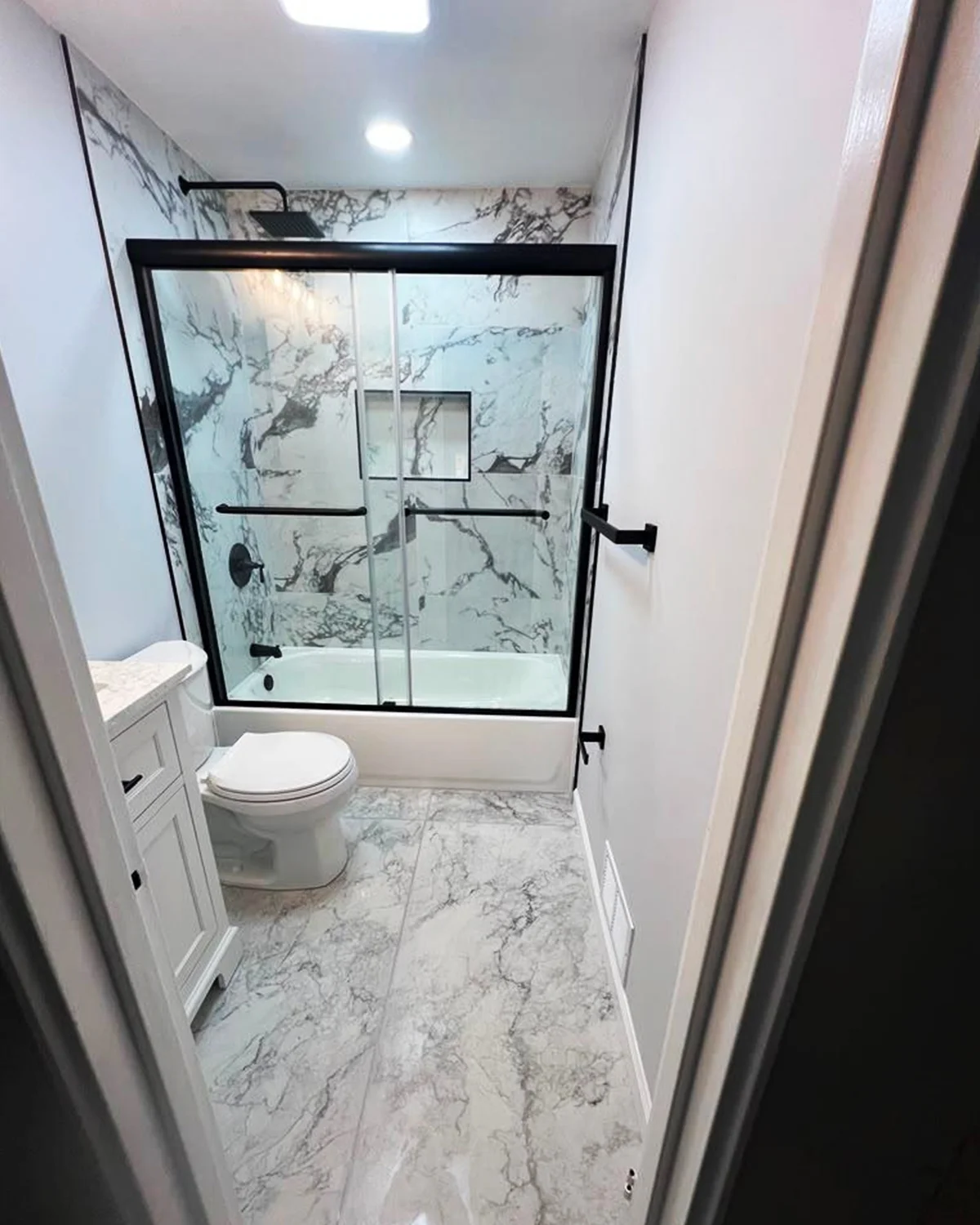 Completed bathroom remodeling project by MERGE Construction Corp