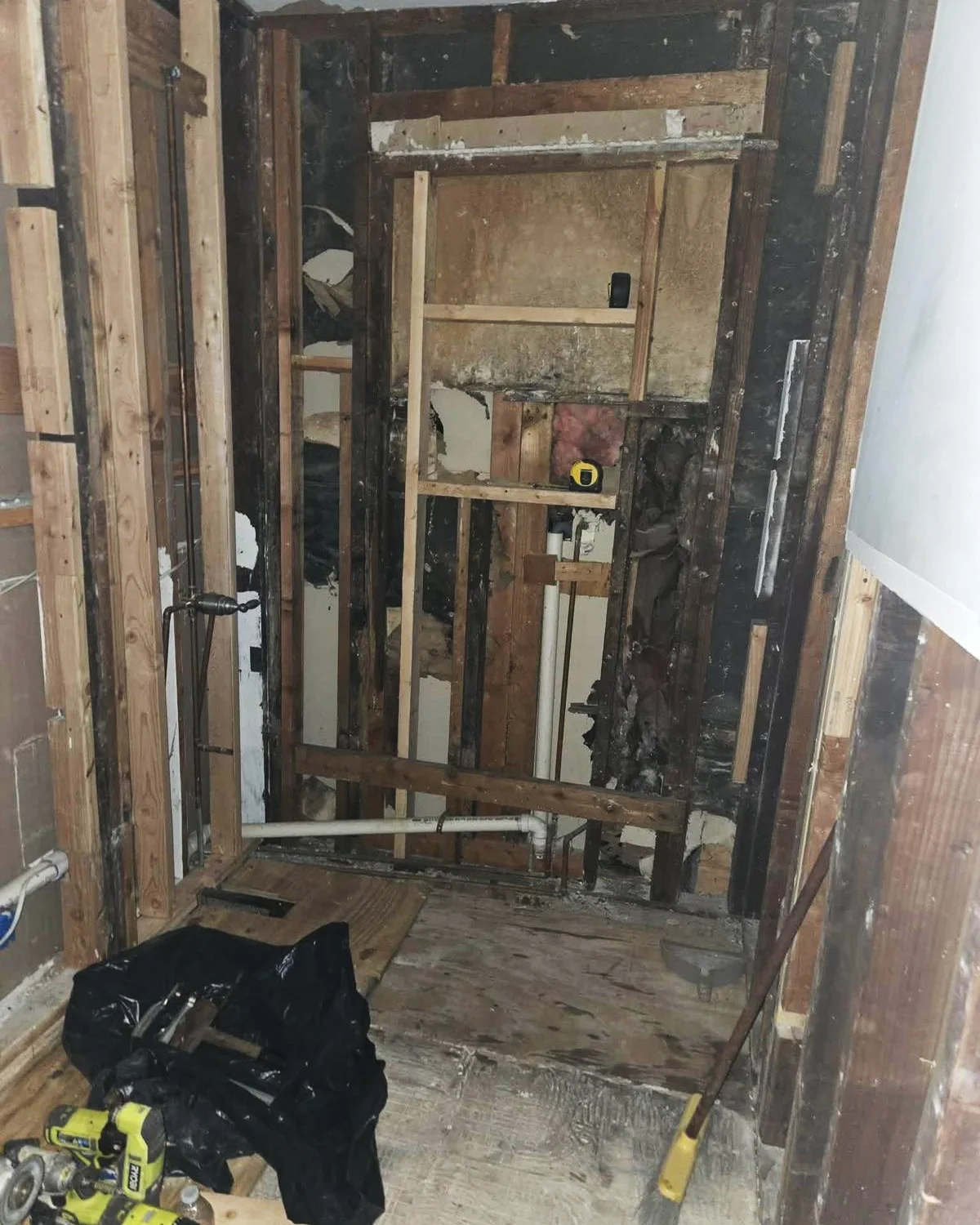 Bathroom opened during remodeling to address existing conditions